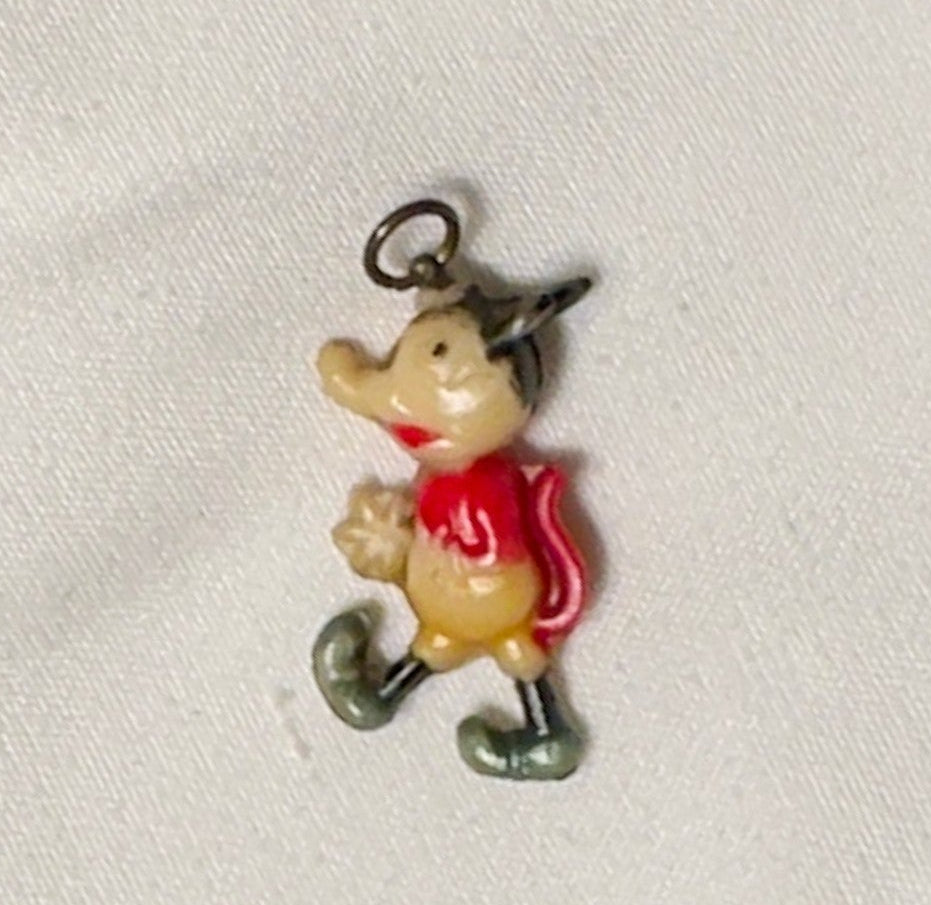 Small character charm on a white background