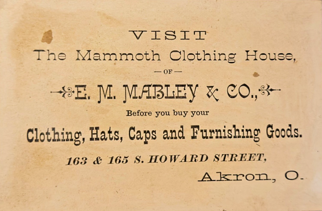 1880 Victorian Trade Card “UNDER COVER” – E.M. Mabley & Co Mammoth Akron, OH ad