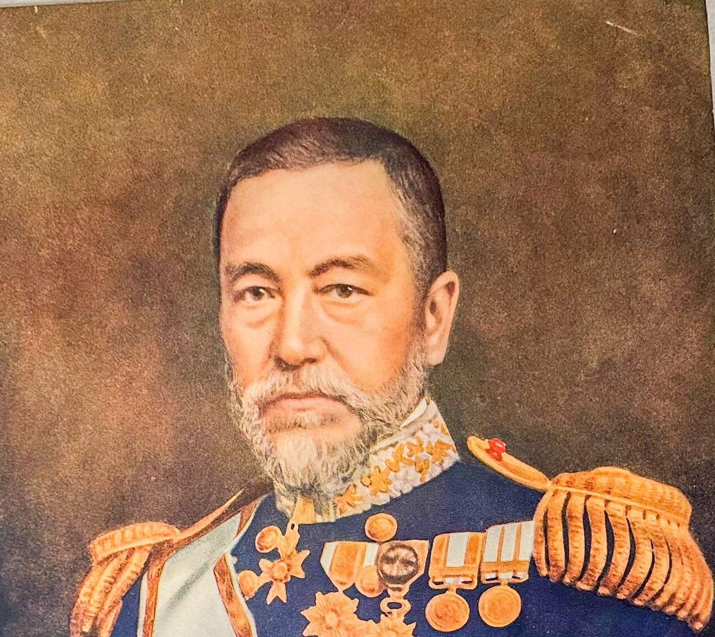 Portrait of a man in military uniform with decorative elements on a brown background