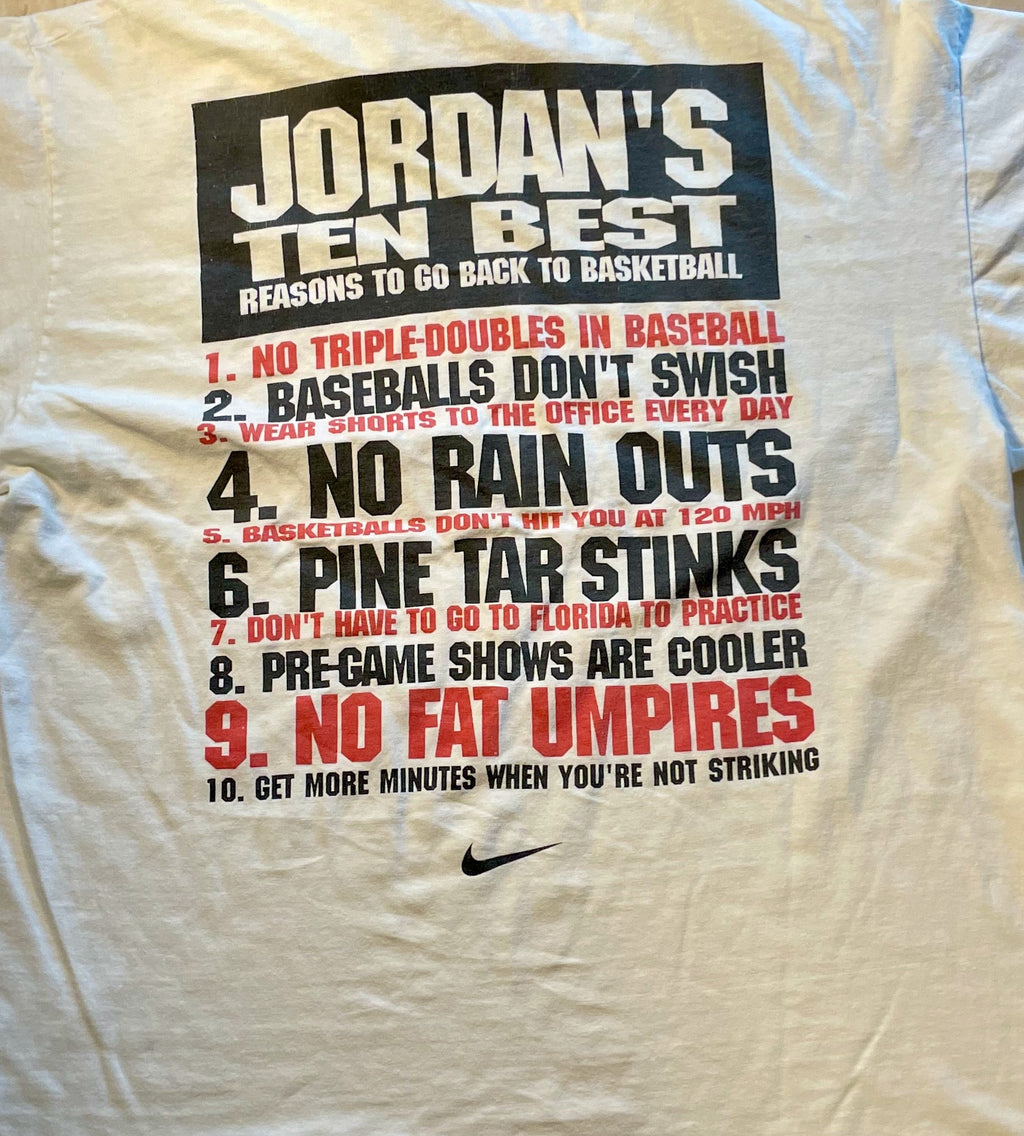 White t-shirt with text on a wooden surface