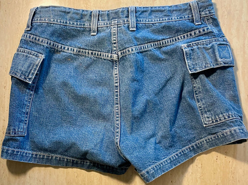 Blue denim shorts on a wooden surface