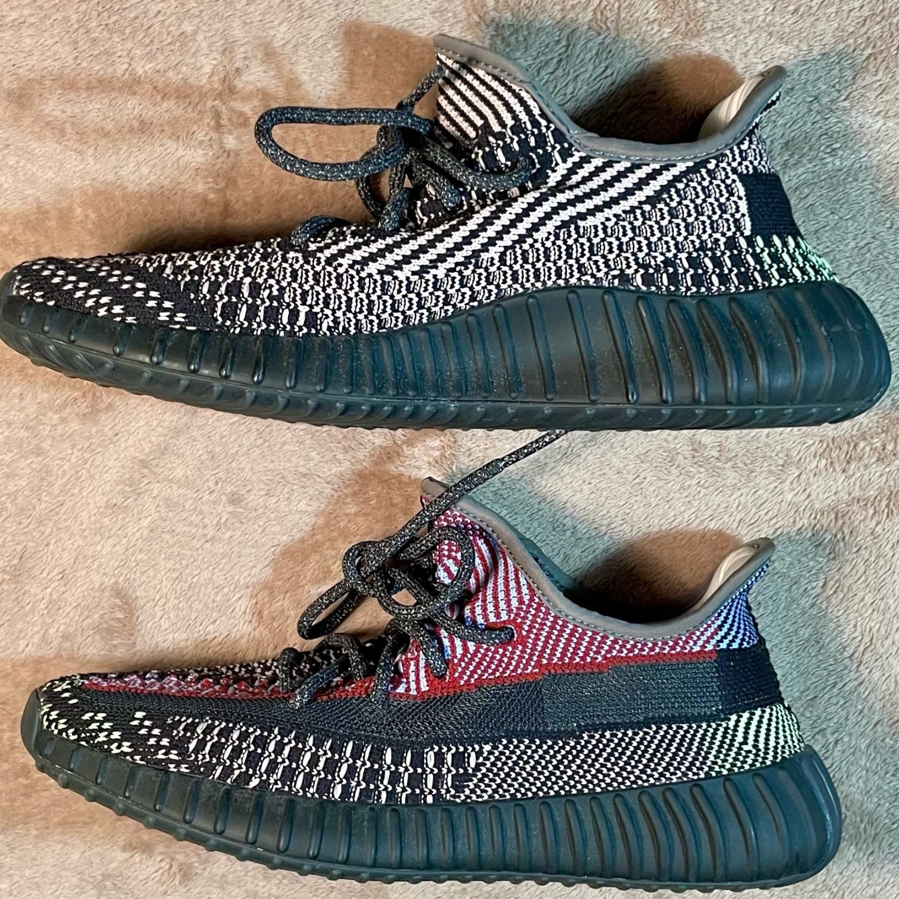 Pair of patterned sneakers on a textured surface
