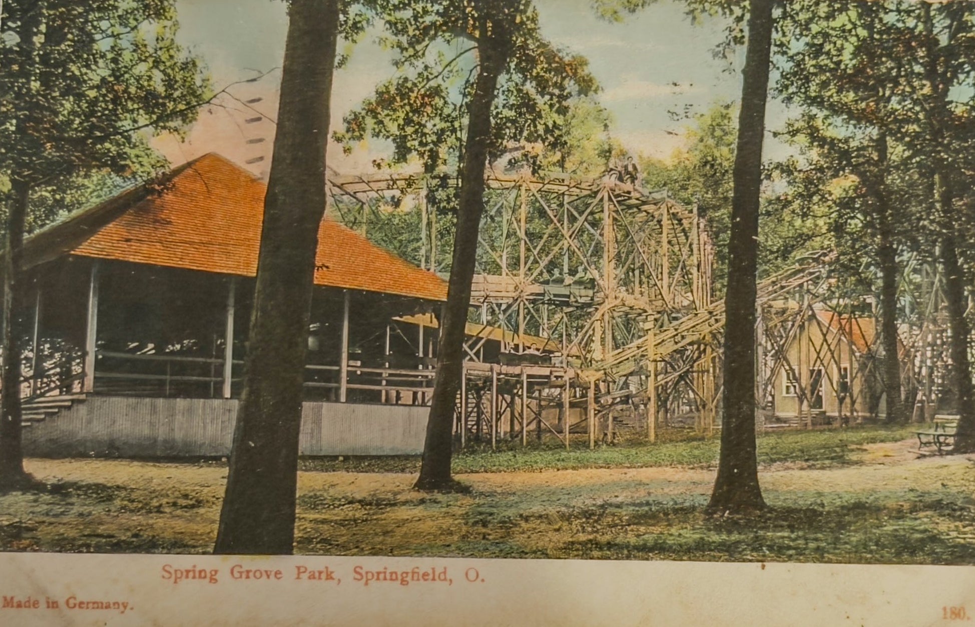 Vintage postcard of Spring Grove Park with a roller coaster and pavilion.