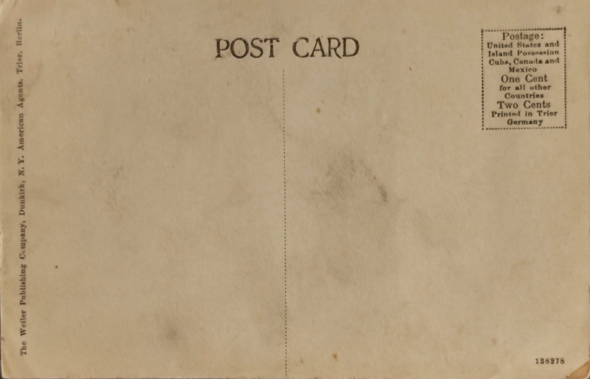 Back of a vintage postcard with text and a brownish color.