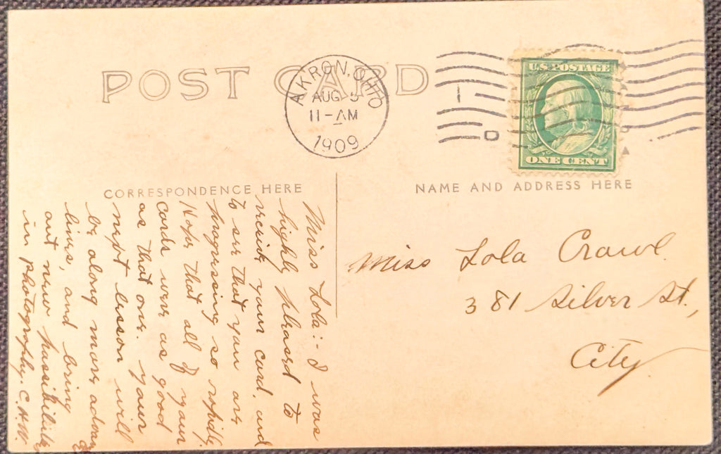 Vintage postcard with postage stamp and handwritten text