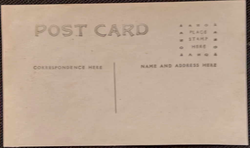 Back of a vintage postcard with pre-printed text for addressing.