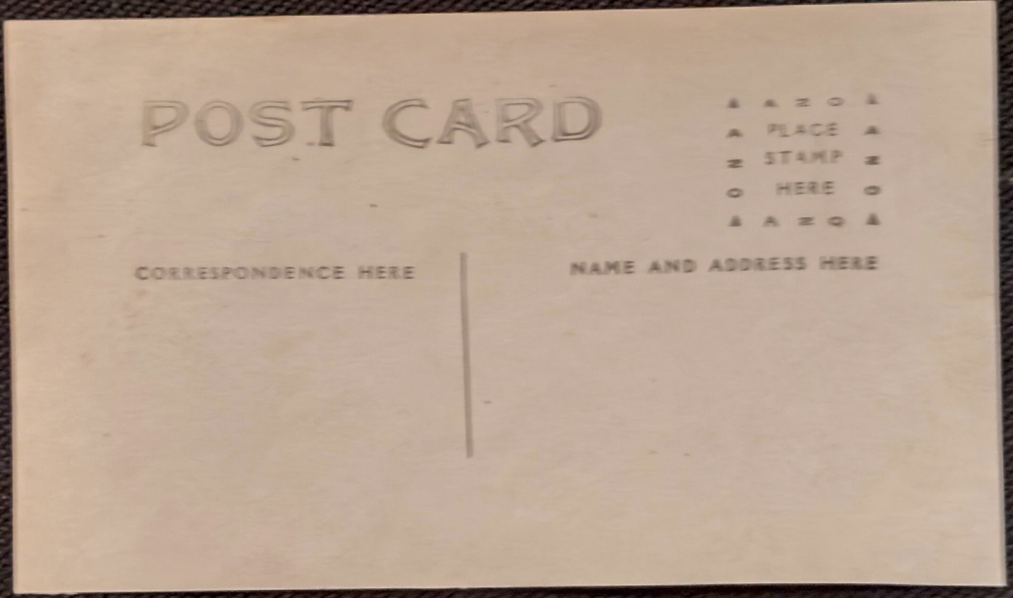 Back of a vintage postcard with pre-printed text for addressing.