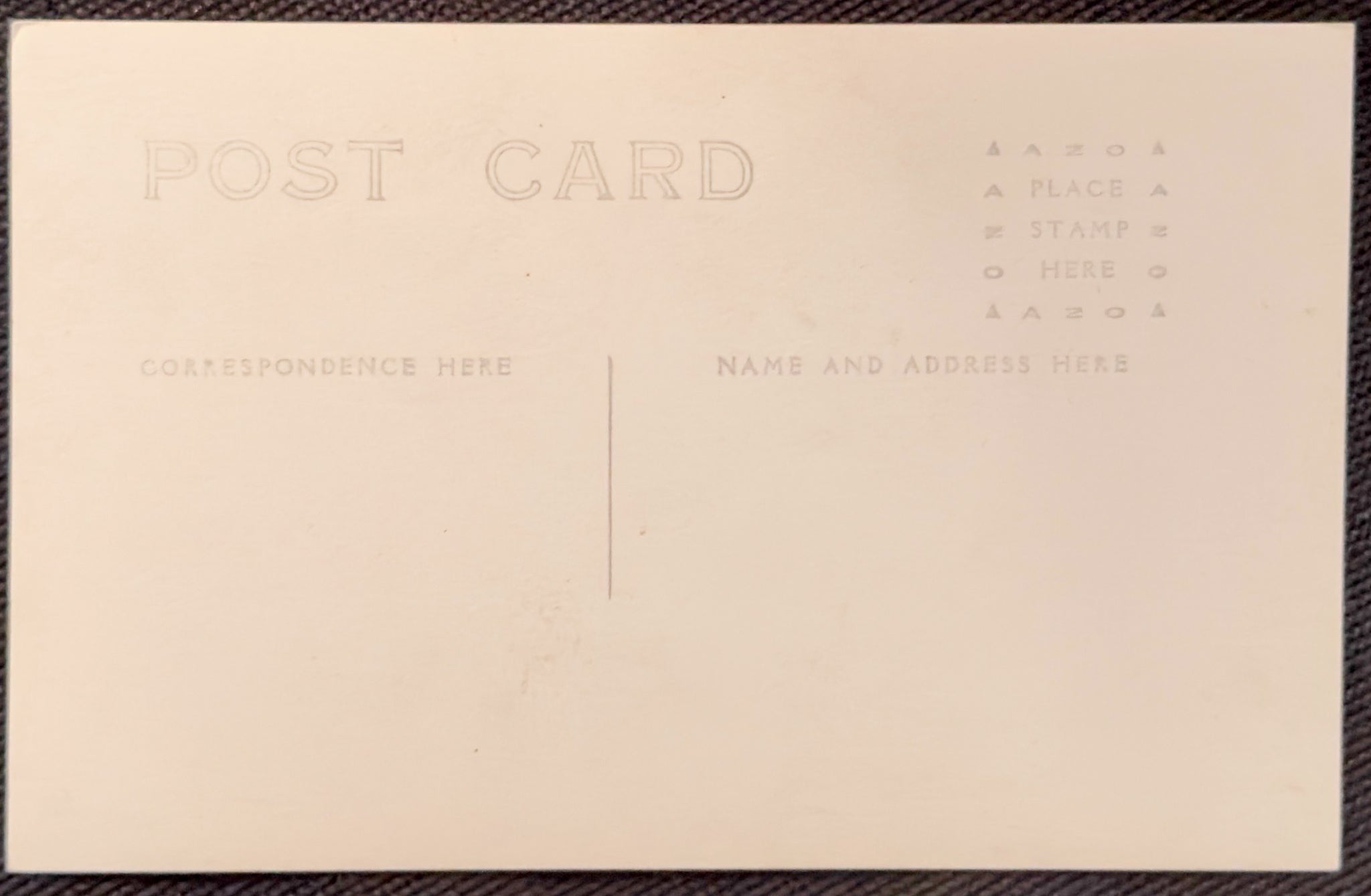 Beige postcard with text fields for correspondence and address on a matching background