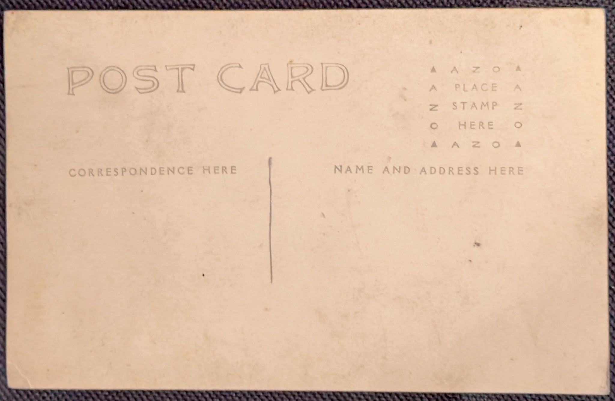 Back of a vintage postcard with pre-printed text for correspondence and address.