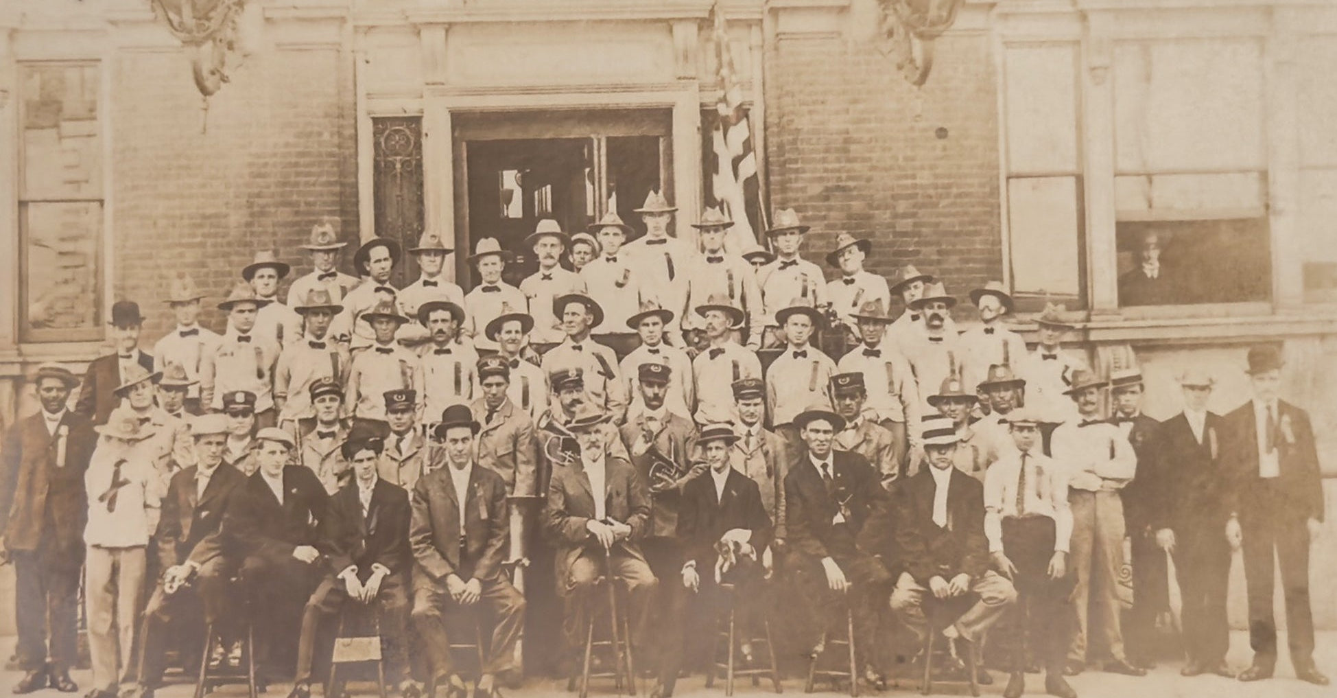 Antique Group Photo Postcard Large Uniformed Men Outside Building Early 1900s Real Photo RPPC