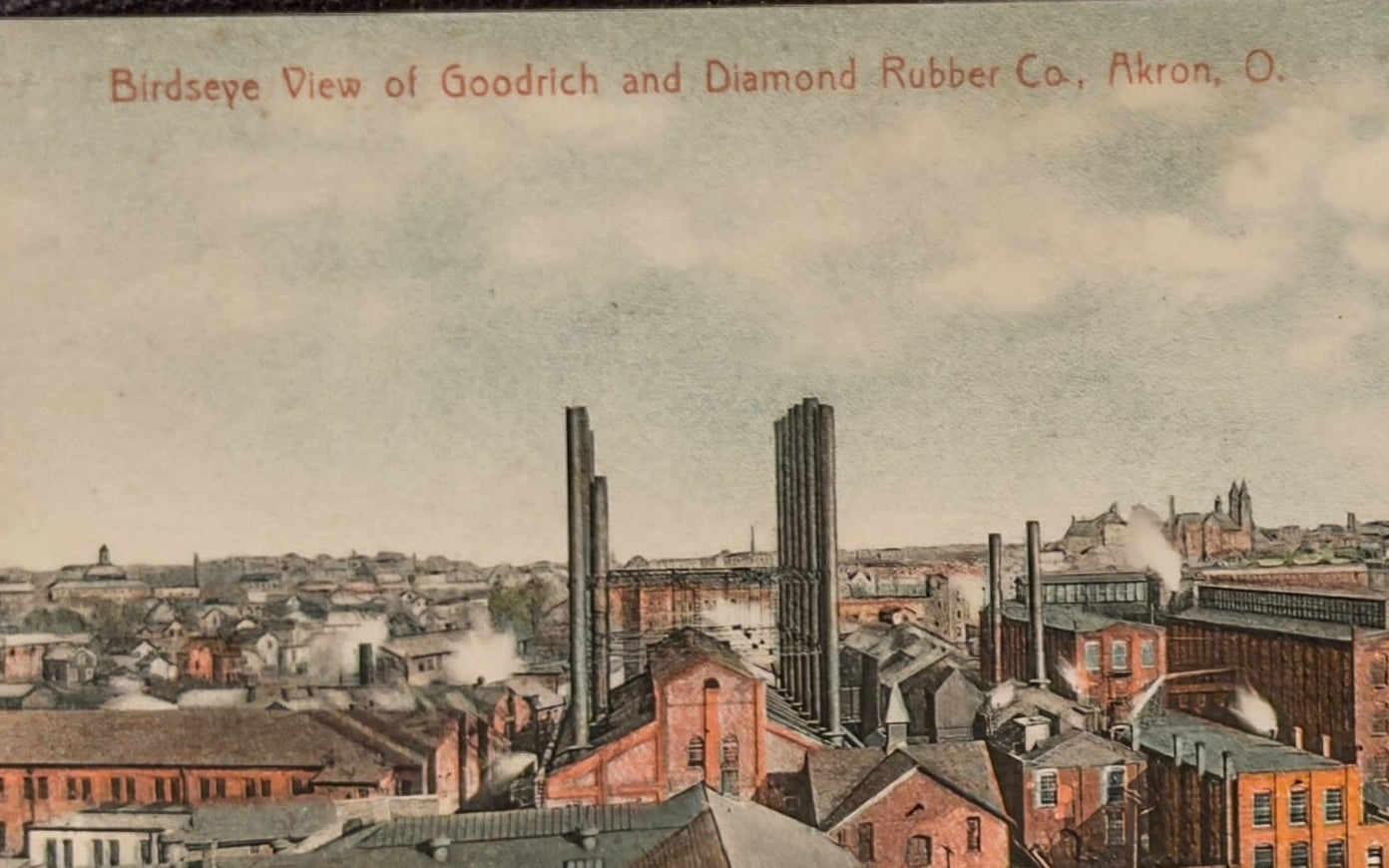 Aerial view of industrial buildings with smokestacks, likely from a rubber company in Akron, Ohio.