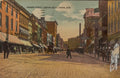 Vintage street scene of Howard Street, looking south in Akron, Ohio, with people and buildings.