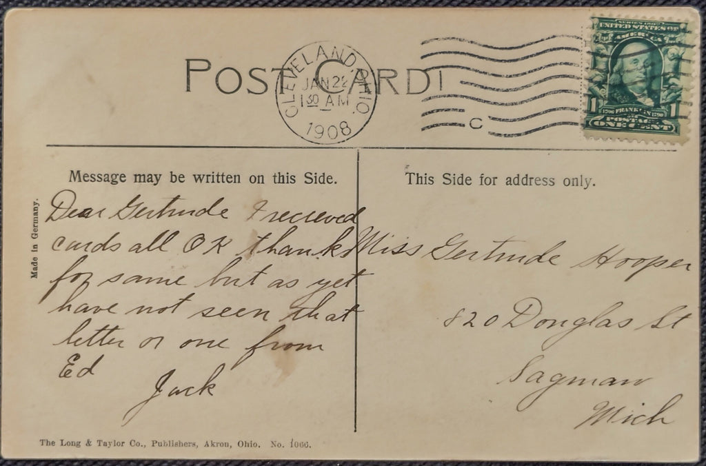 Vintage postcard with text, stamps, and a stamp cancel from 1908.
