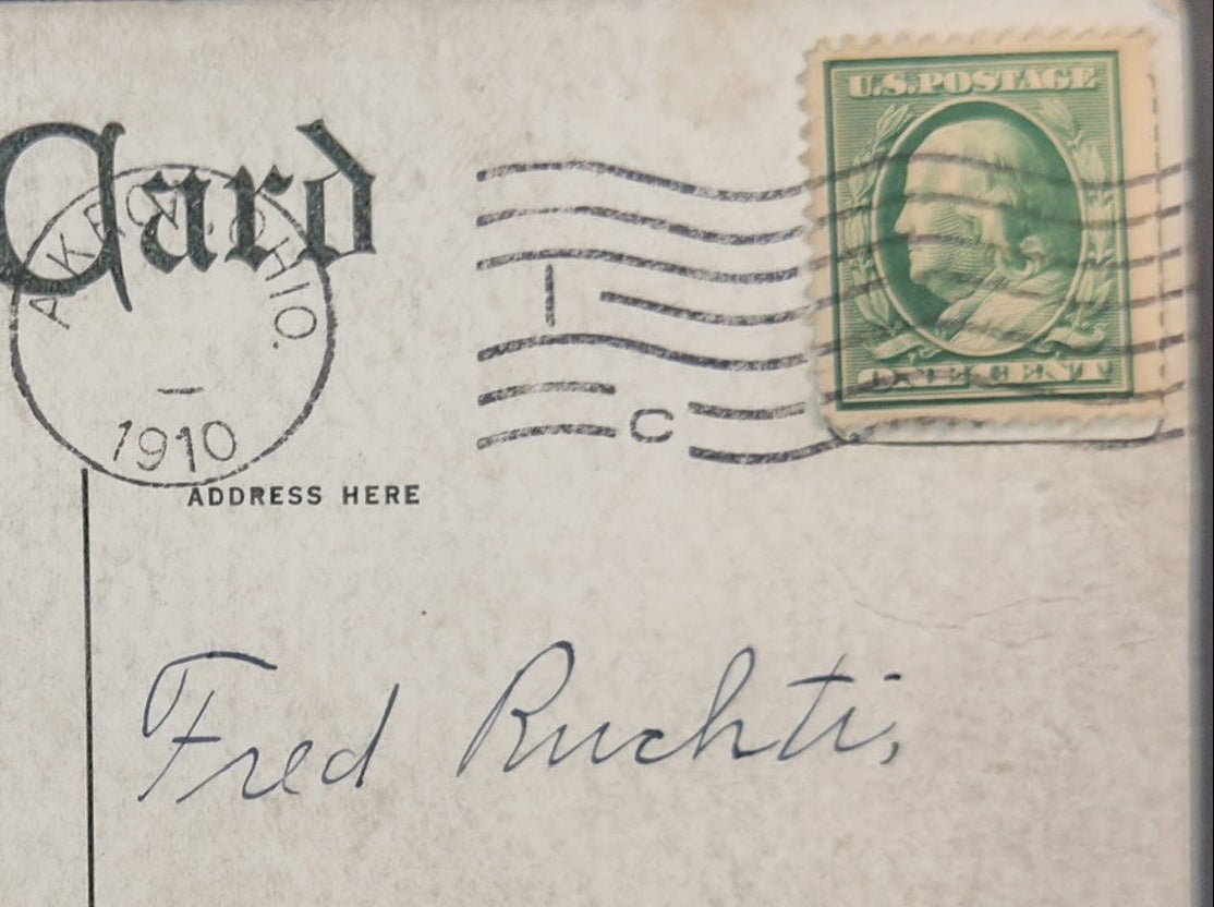 Vintage postcard with postage stamp and handwritten address