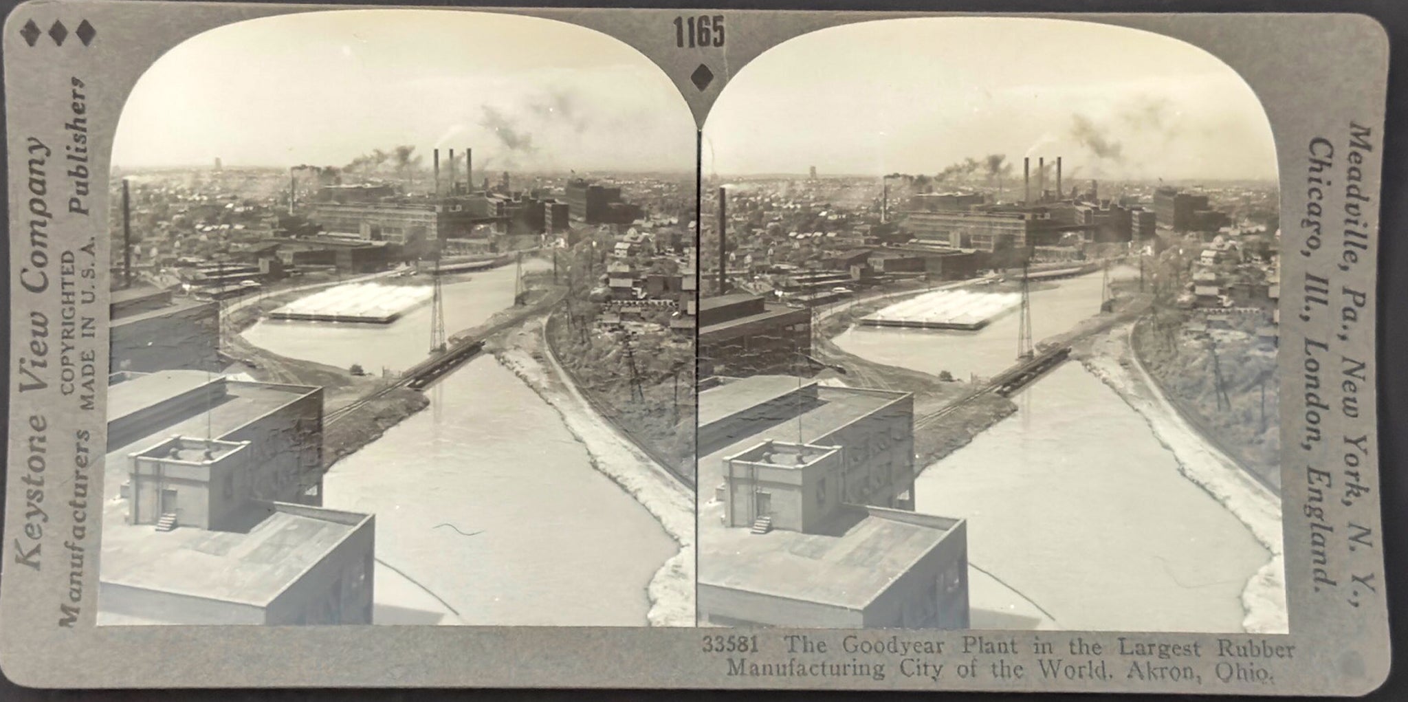 Stereoscopic view of a cityscape with buildings and a river, labeled 'Keystone View Company'.