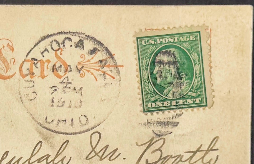 Vintage postcard with postage stamp and envelope details