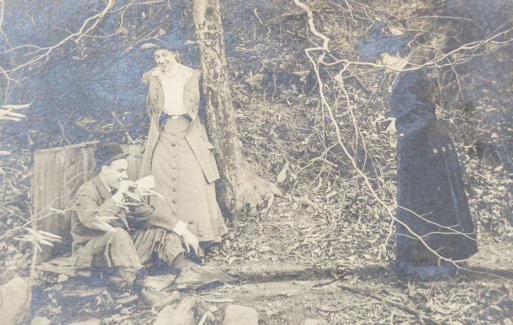 Vintage photograph of a group of people in a forest setting
