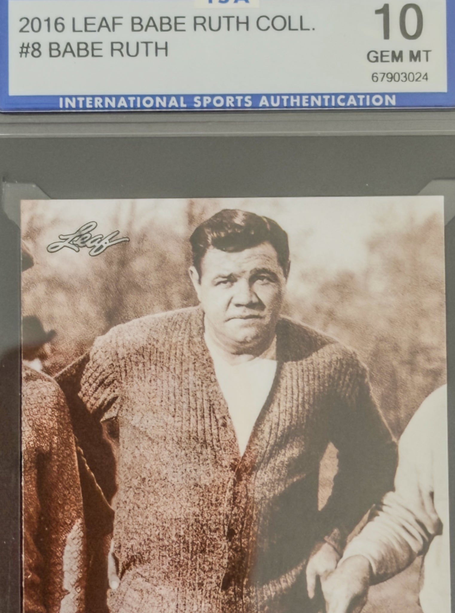 Vintage sports card of Babe Ruth with 'Leaf' branding and authentication details.