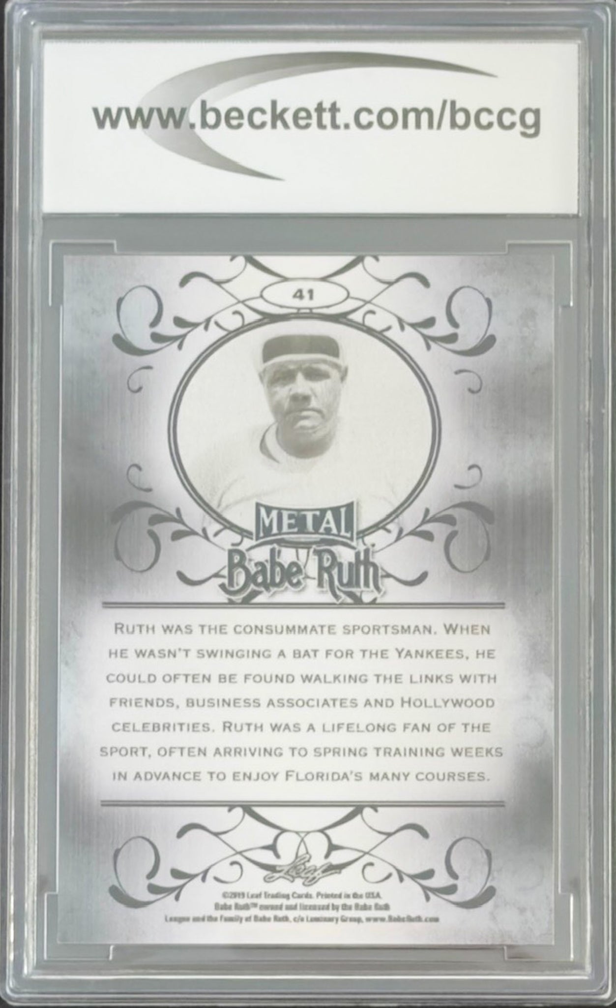 Metallic Babe Ruth trading card with decorative elements and text on a silver background