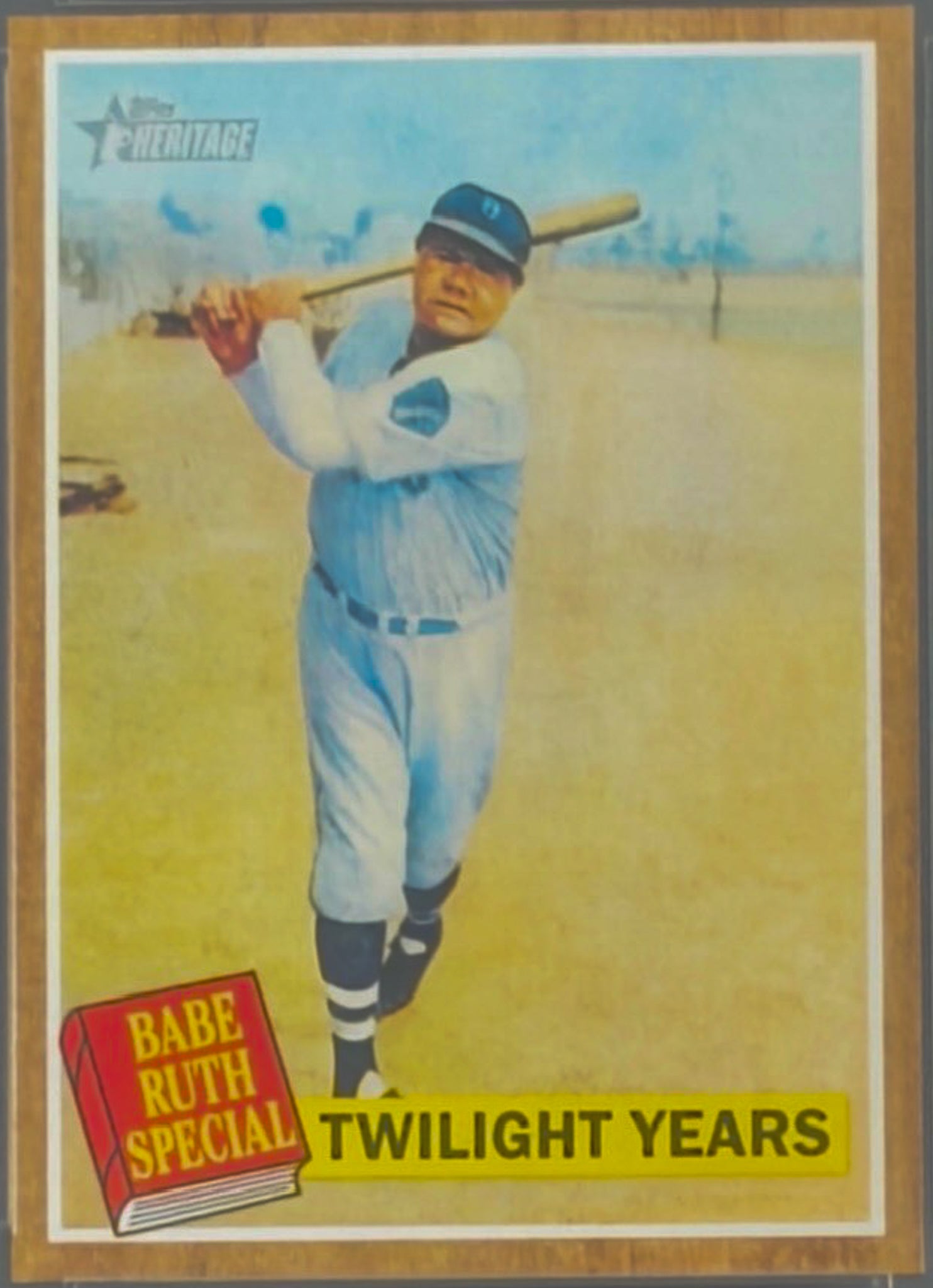 Baseball trading card featuring Babe Ruth with a bat, framed by a wooden border.