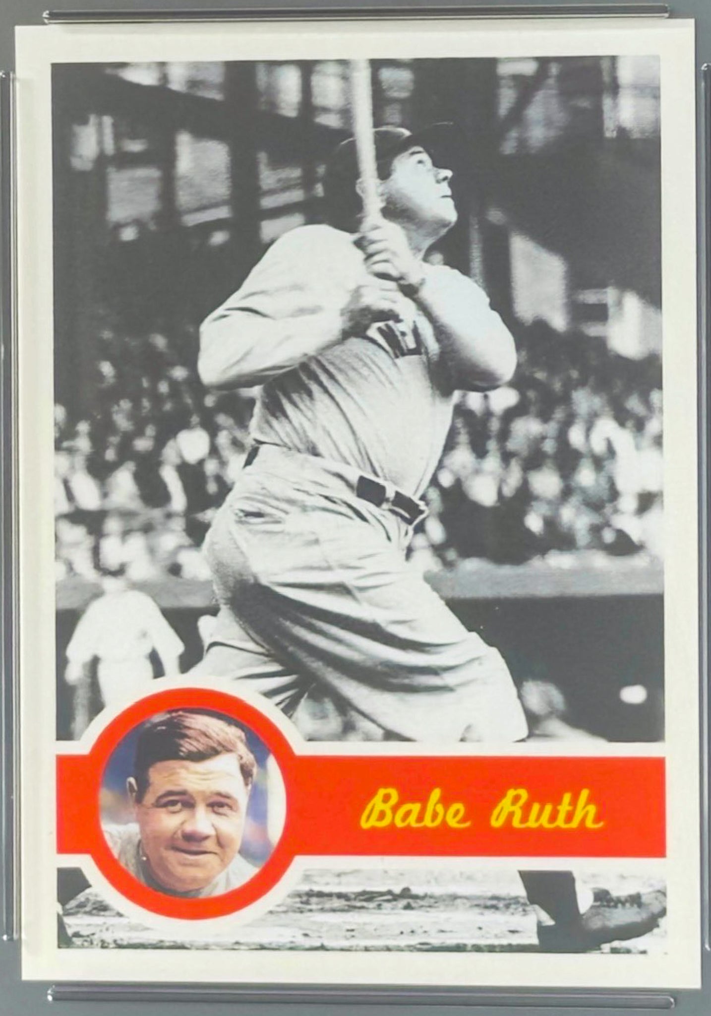 Vintage baseball trading card of Babe Ruth in a batting pose with a small inset photo of Babe Ruth's face.