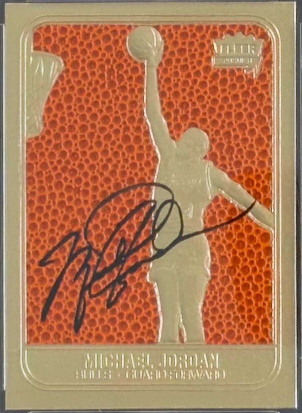Basketball trading card of Michael Jordan in a protective case with grading information.