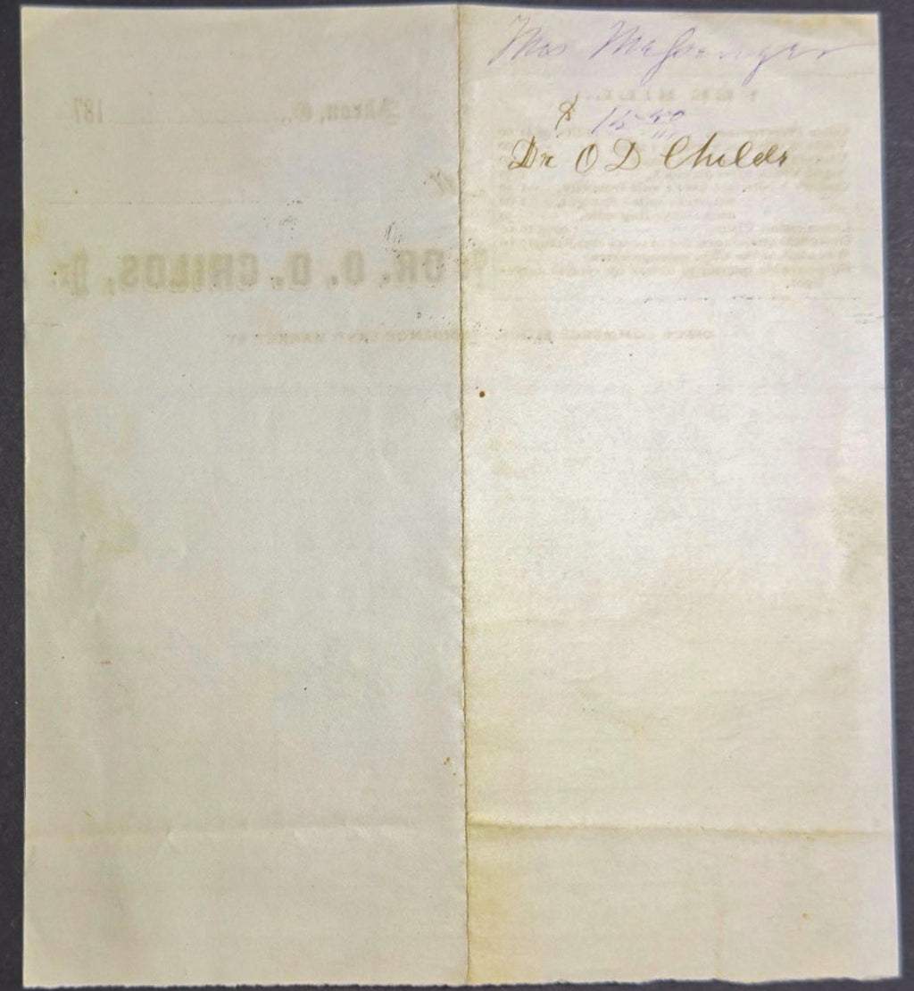 Folded paper with printed text on a dark background