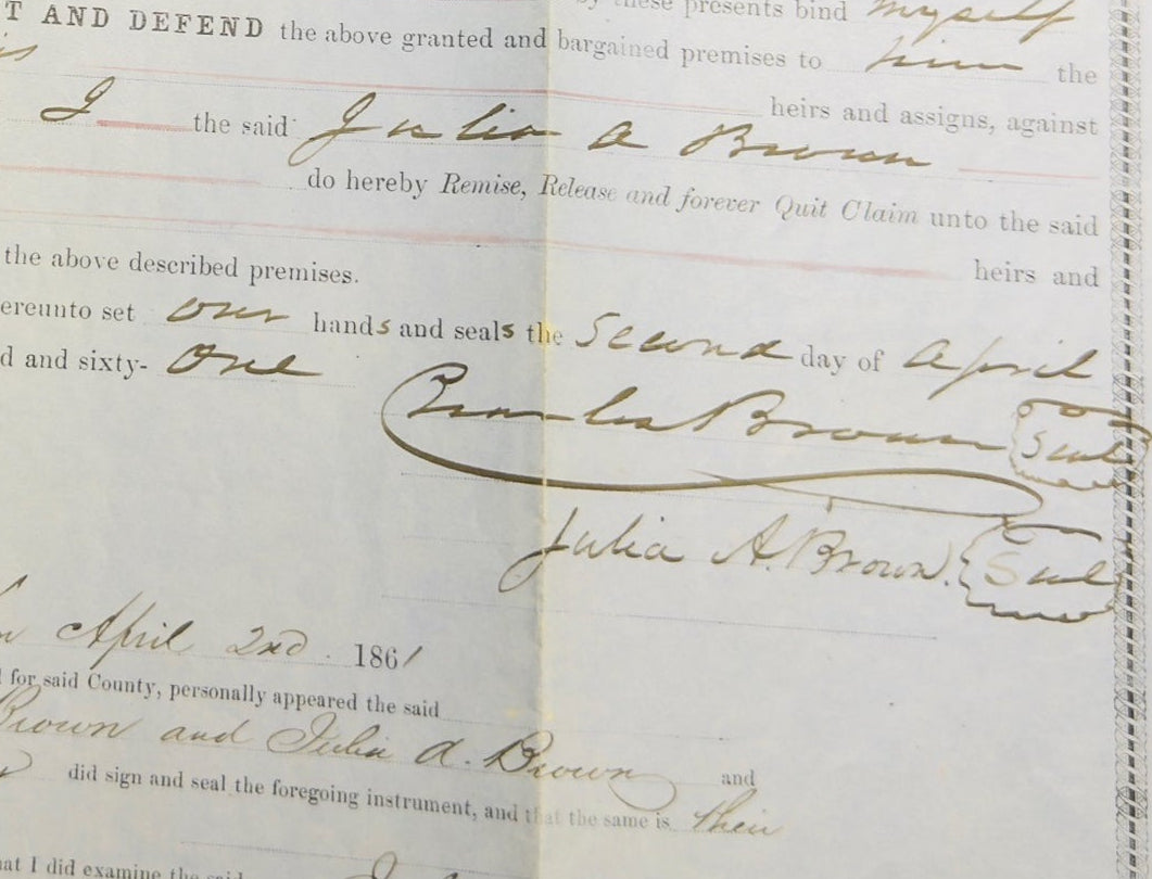 Document with handwritten text and a yellow stamp on a white background